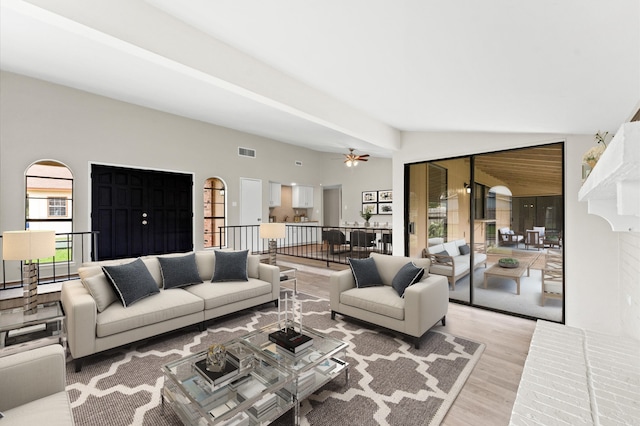 living room featuring ceiling fan and light wood-type flooring