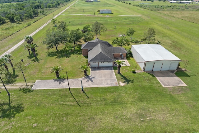 birds eye view of property with a rural view