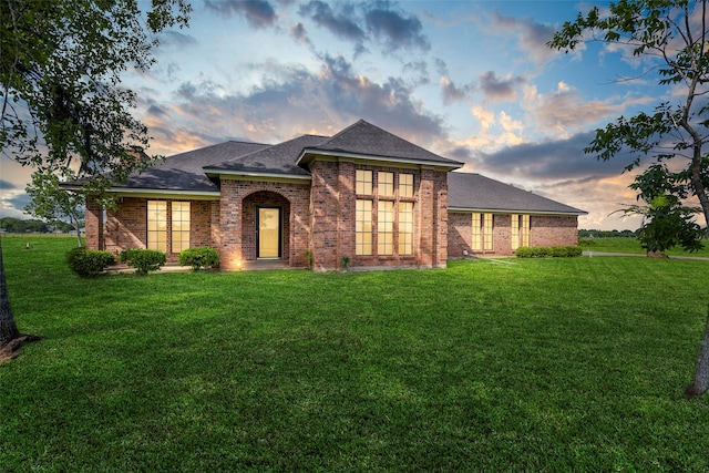 view of front of property with a yard