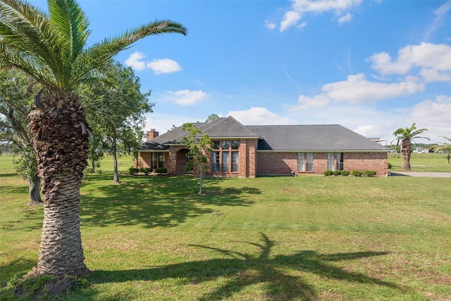 single story home with a front yard