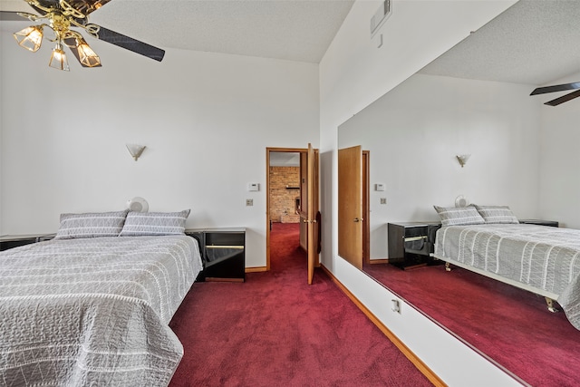 bedroom with carpet, ceiling fan, a textured ceiling, and high vaulted ceiling