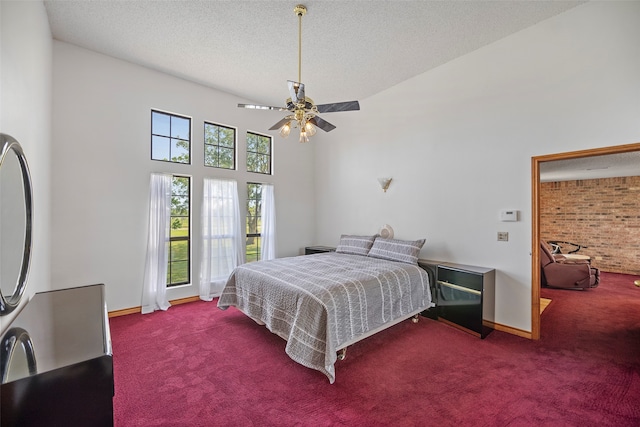 bedroom with carpet, ceiling fan, and a textured ceiling