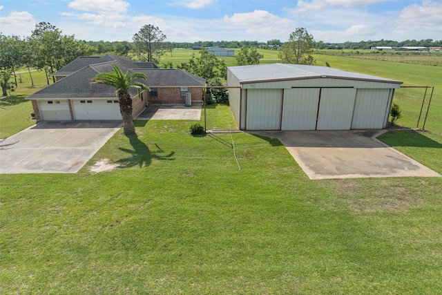 exterior space with an outdoor structure and a rural view