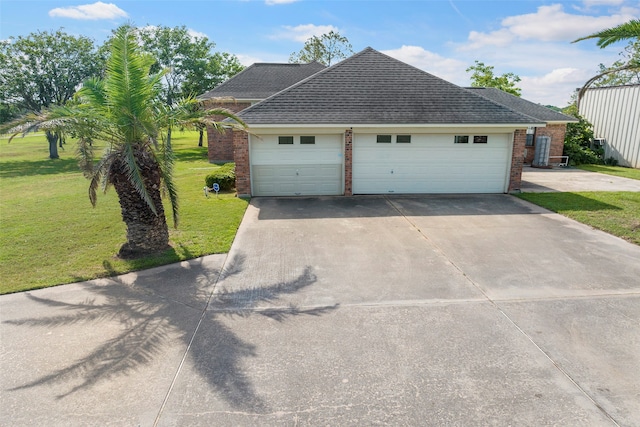 view of front of home with a garage and a front yard