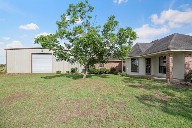 view of yard with a garage