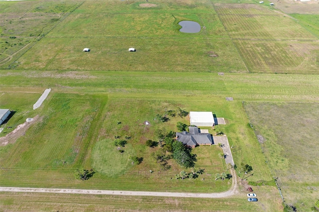 birds eye view of property featuring a rural view