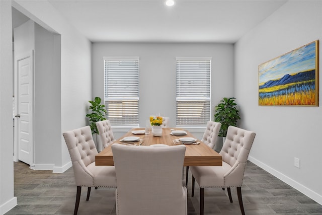 dining area with dark wood-type flooring