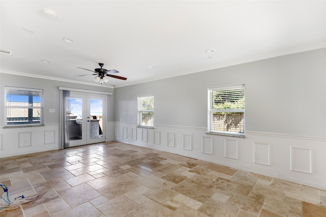 tiled empty room with ceiling fan, french doors, and crown molding