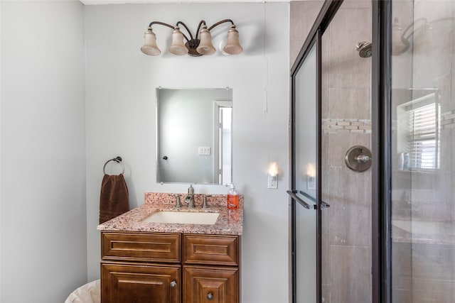 bathroom with an enclosed shower and large vanity