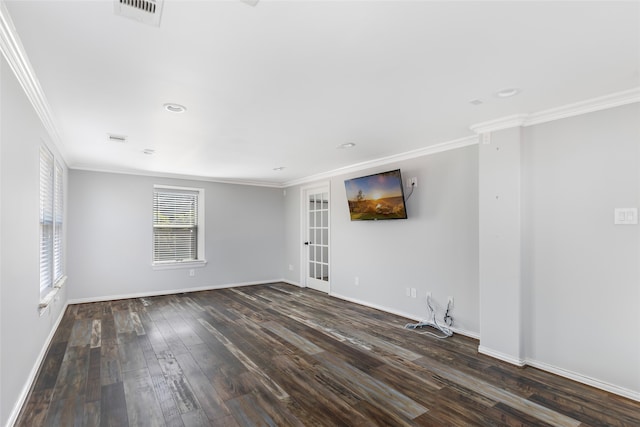 empty room featuring ornamental molding, french doors, and hardwood / wood-style flooring