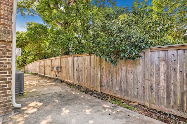 view of yard with a patio and central AC