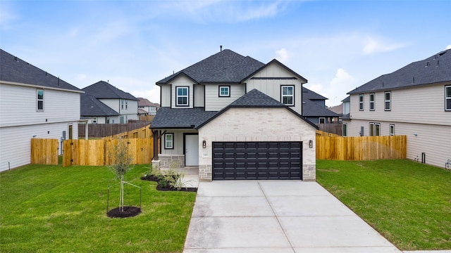 view of front of home featuring a garage and a front lawn