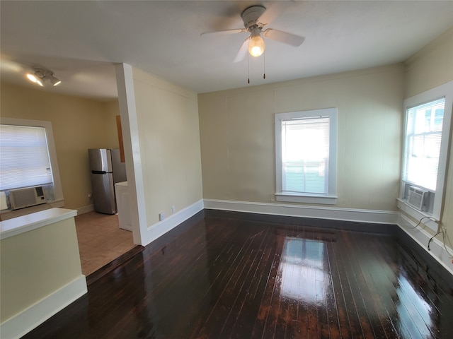 unfurnished room featuring ceiling fan and hardwood / wood-style flooring