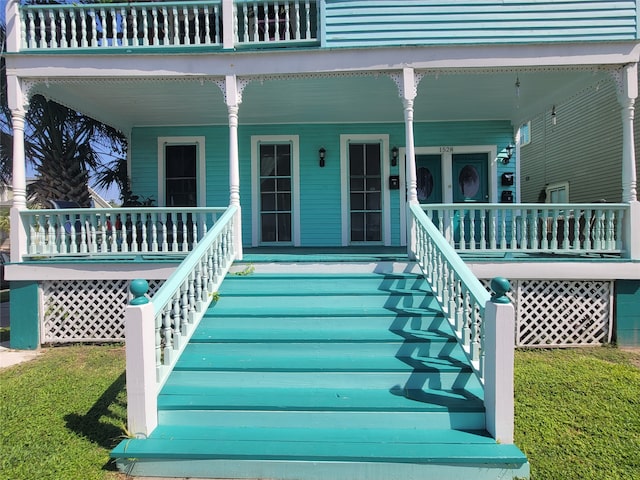 doorway to property with covered porch