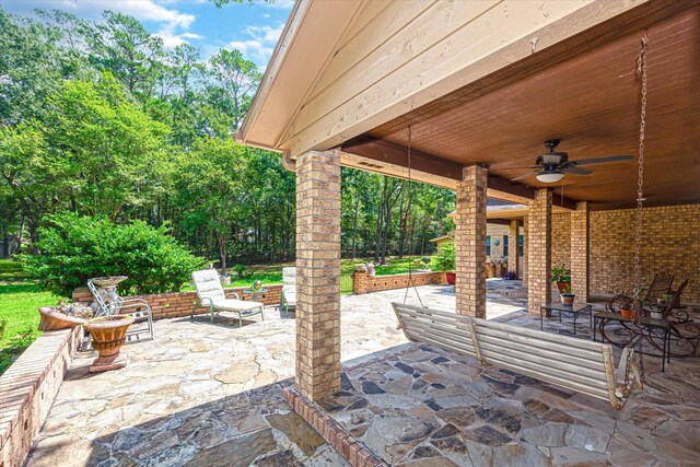 view of patio / terrace featuring ceiling fan