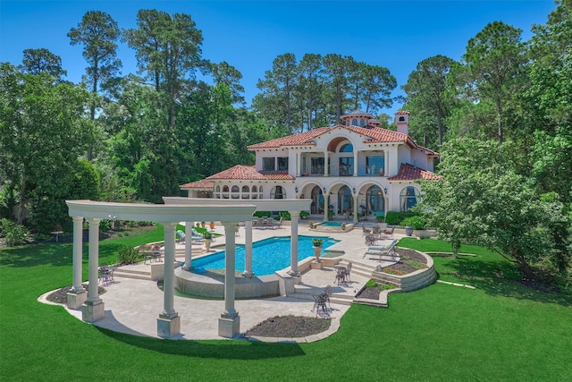 view of swimming pool featuring a yard and a patio area