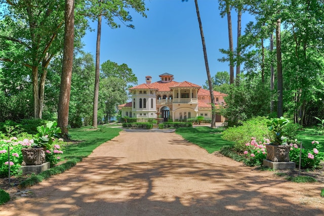 mediterranean / spanish-style home with a balcony