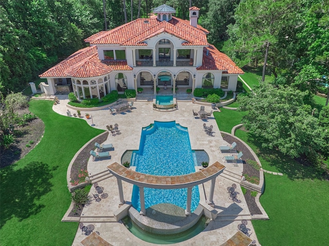 view of swimming pool with a patio area and a lawn