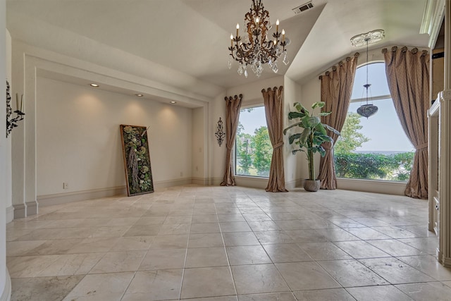 spare room featuring lofted ceiling, an inviting chandelier, a wealth of natural light, and light tile floors