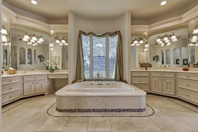 bathroom featuring tile flooring, vanity with extensive cabinet space, a bathing tub, and double sink