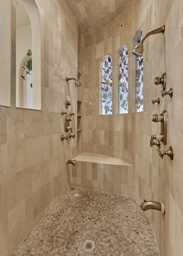 bathroom featuring tiled shower