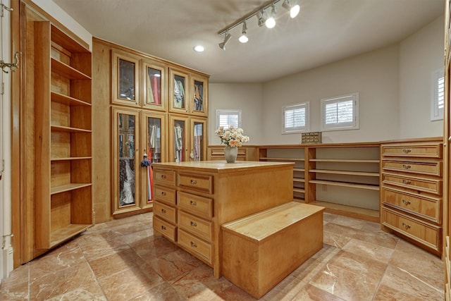 spacious closet with light tile flooring