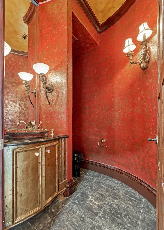 bathroom with crown molding and tile flooring