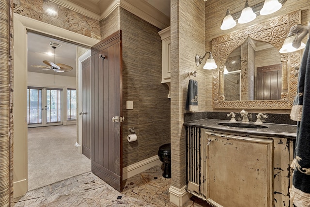 bathroom with tile floors, ornamental molding, vanity, and ceiling fan