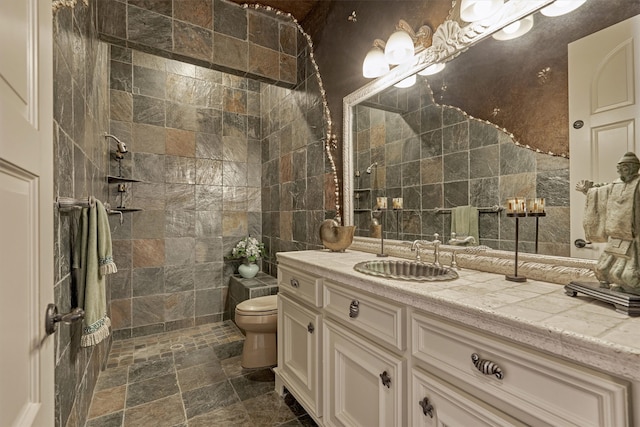 bathroom with tile walls, tile floors, toilet, and oversized vanity