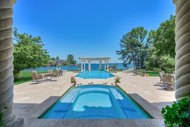 view of pool with a patio, a pergola, an in ground hot tub, and a water view