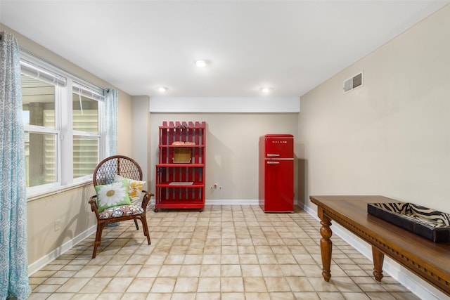 living area featuring tile floors