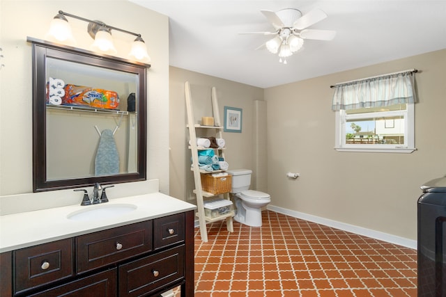 bathroom featuring ceiling fan, vanity, and toilet