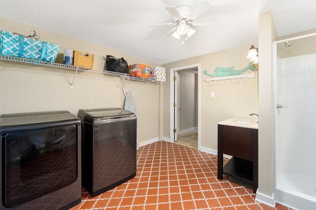 clothes washing area with tile floors, sink, washer and clothes dryer, and ceiling fan