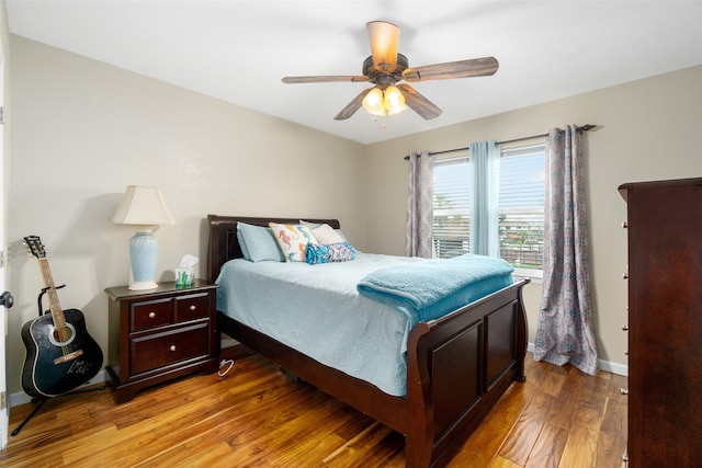 bedroom with ceiling fan and hardwood / wood-style floors