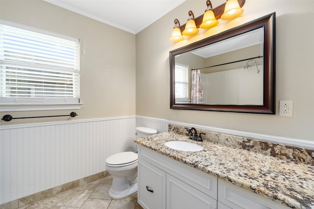 bathroom featuring tile floors, crown molding, toilet, and large vanity