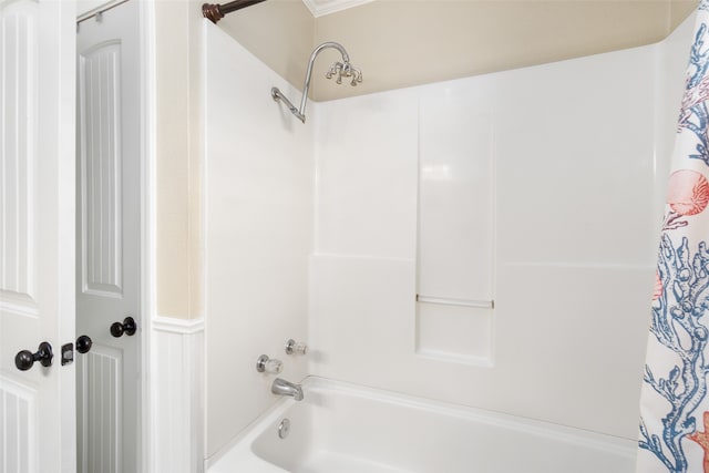 bathroom featuring shower / bath combo with shower curtain