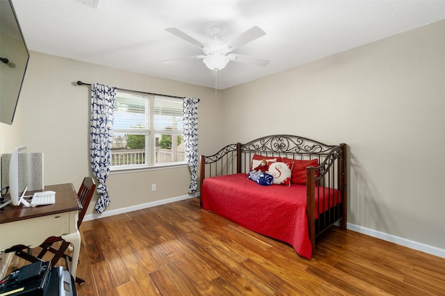 bedroom featuring ceiling fan and hardwood / wood-style flooring