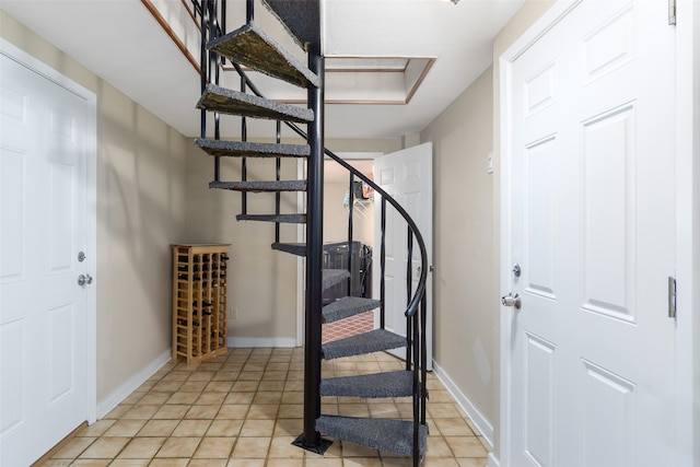 staircase with light tile floors