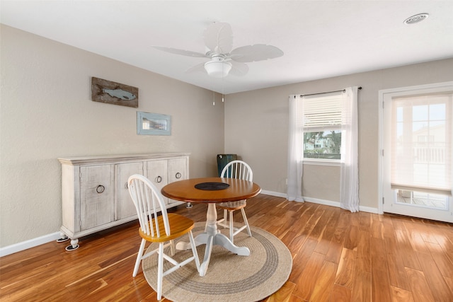 dining area with plenty of natural light, ceiling fan, and light wood-type flooring