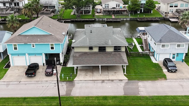 birds eye view of property with a water view