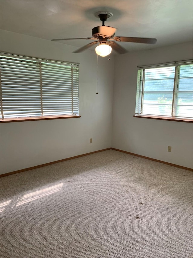 unfurnished room with carpet floors and ceiling fan