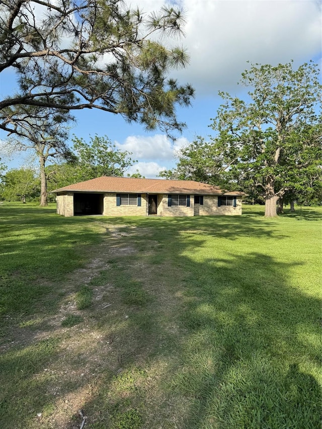 9639 Fm 524, Sweeny, TX 77480 - rear view of house featuring a yard