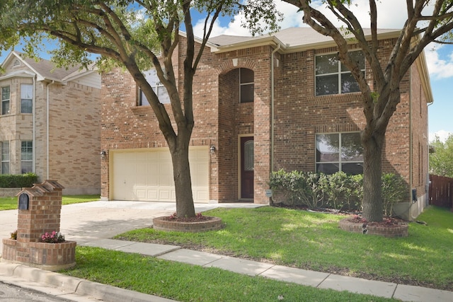 view of front of home with a garage and a front yard