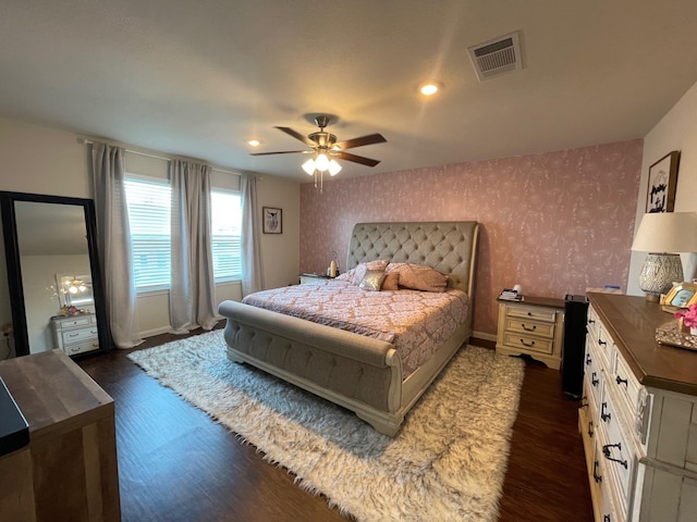 bedroom featuring ceiling fan and dark hardwood / wood-style flooring