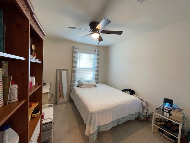 bedroom featuring ceiling fan and light colored carpet