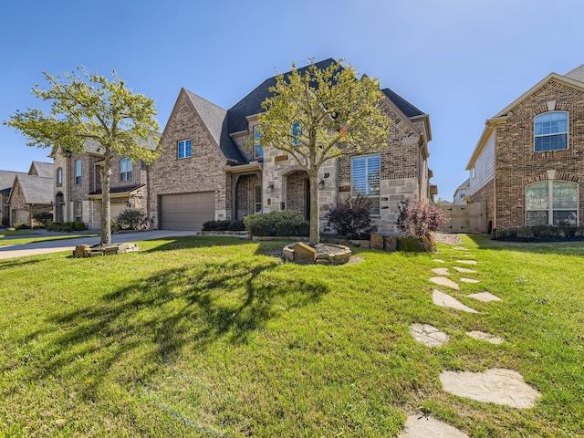 view of front of house with a garage and a front yard