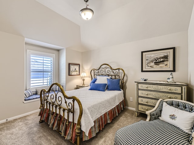 carpeted bedroom with vaulted ceiling