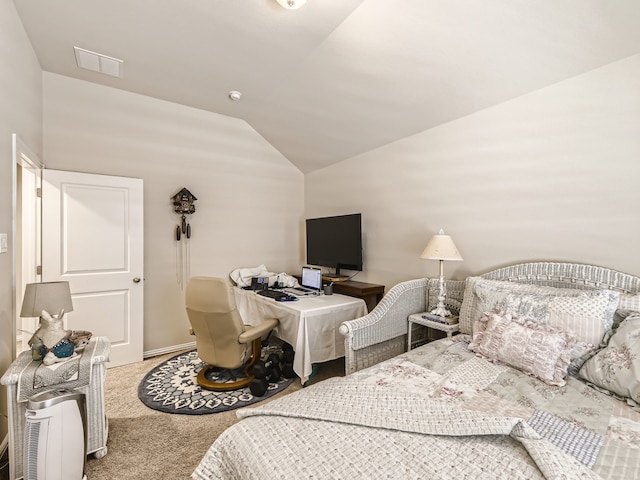 bedroom featuring carpet and lofted ceiling