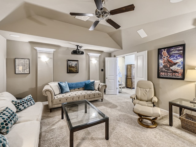 carpeted living room featuring ceiling fan and lofted ceiling