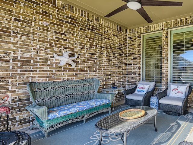 view of patio with ceiling fan and an outdoor hangout area